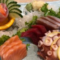 Sashimi Regular · 15 pieces of assorted fresh raw fish with a bowl of rice on side.