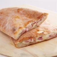 Baked Ham Calzone · Baked ham, pomodoro sauce, and mozzarella