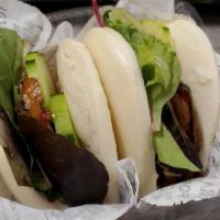 Chashu Bun · Steamed bun stuffed with slow-braised pork chashu, and baby mixed greens that served with or...