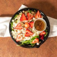 Strawberry Spinach · Spinach, strawberries, pecans, sliced almonds, feta cheese, with a red wine vinaigrette.
