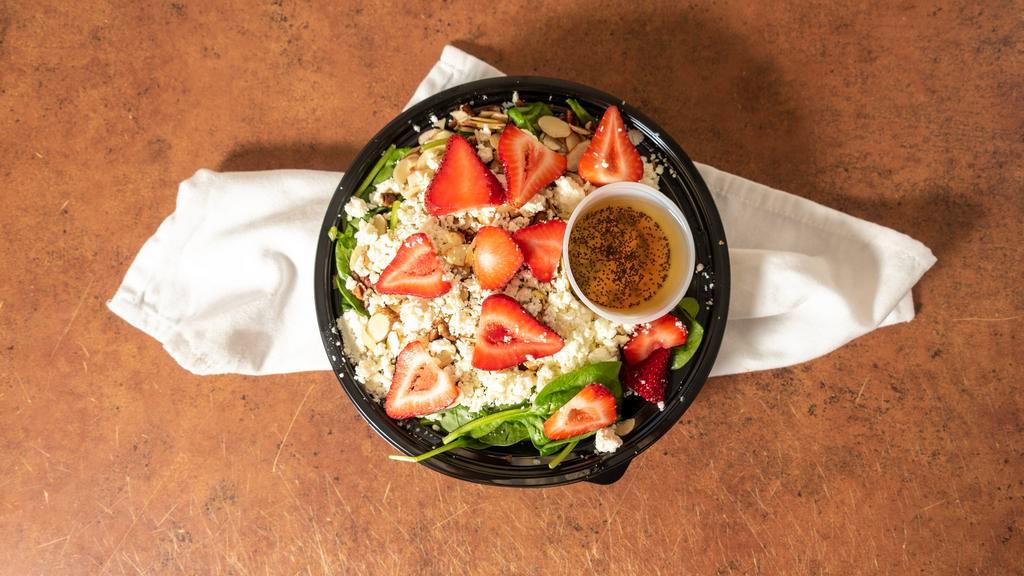 Strawberry Spinach · Spinach, strawberries, pecans, sliced almonds, feta cheese, with a red wine vinaigrette.
