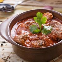 Lamb Bhuna Combo · Freshly prepared combination of tandoori lamb bhuna, with a side of naan, side of rice, and ...