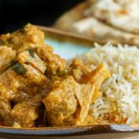 Goat Curry Combo · Freshly prepared combination of goat curry, with a side of naan, side of rice, and a 12 oz s...