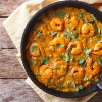 Shrimp Bhuna Combo · Freshly prepared combination of  shrimp curry, with a side of naan, side of rice, and a 12 o...
