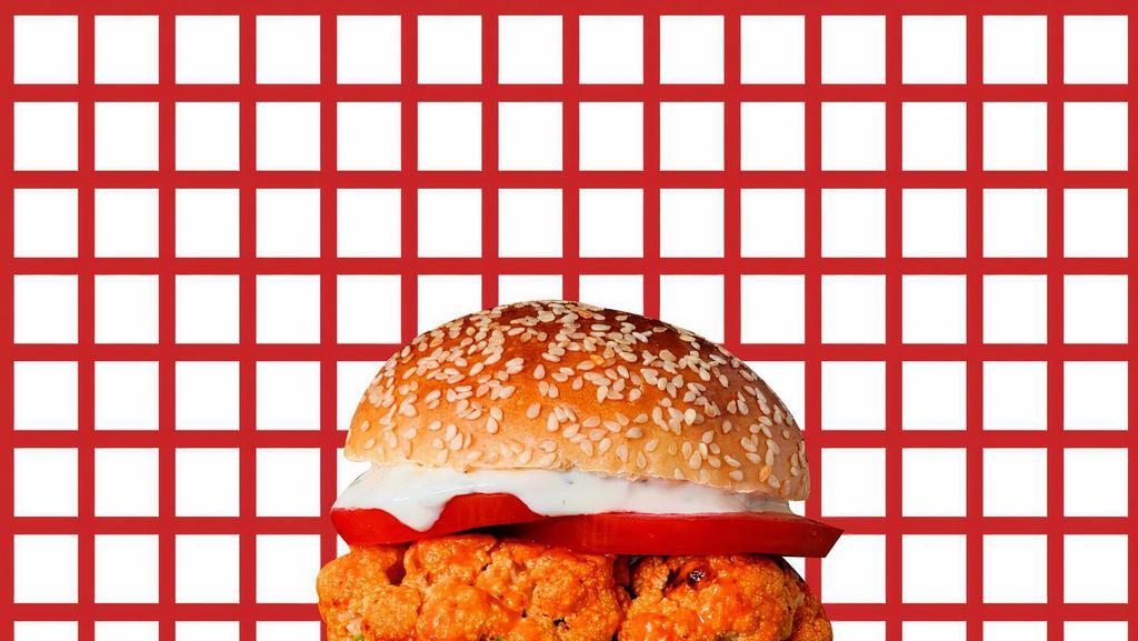 Triple Crispy Chicken Burger  · Triple crispy chicken, mayo, buffalo sauce, lettuce, tomato, onion, and American cheese.