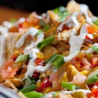 Rht Nachos · House-fried Mayan white corn tortilla chips, cheddar jack cheese, diced tomatoes, cherry pep...