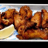 Rotisserie Chicken Wings · Basket of 8 Delicious Chicken Wings with a Rotisserie Dry Rub that are Fried to Perfection w...