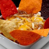 Bowl Angus Beef Chili Soup · Topped with Blended Cheeses & served with Tri-Color Tortilla Chips