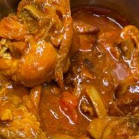 Pollo Guisado / Stew Chicken · White rice , Rice and beans or Fried Plantains.