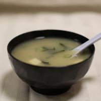 Miso Soup · Served with soybean soup, seaweed, tofu and scallions.