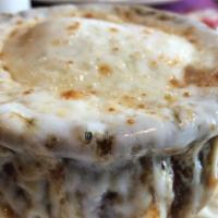 Crock Of French Onion Soup · Served with melted cheese.