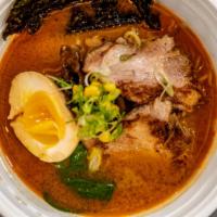 Spicy Miso Ramen · Spicy miso ramen noodle soup with pork chasu, soft boiled egg, yellow corn, spinach, and mus...