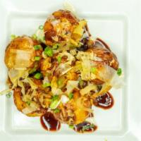 Takoyaki (6Pc) · Fried Japanese mountain potato with octopus, drizzled with barbeque sauce and mayo, topped w...