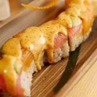 Fire Rainbow Roll · Spicy tuna with rainbow fish on top with spicy sauce.