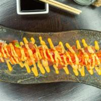 Spicy Tuna King · Rainbow spicy salmon roll with spicy tuna tartare.