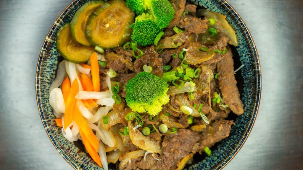 Beef Bulgogi · Beef marinated in sweet and savory sauce with onion and scallion over white rice