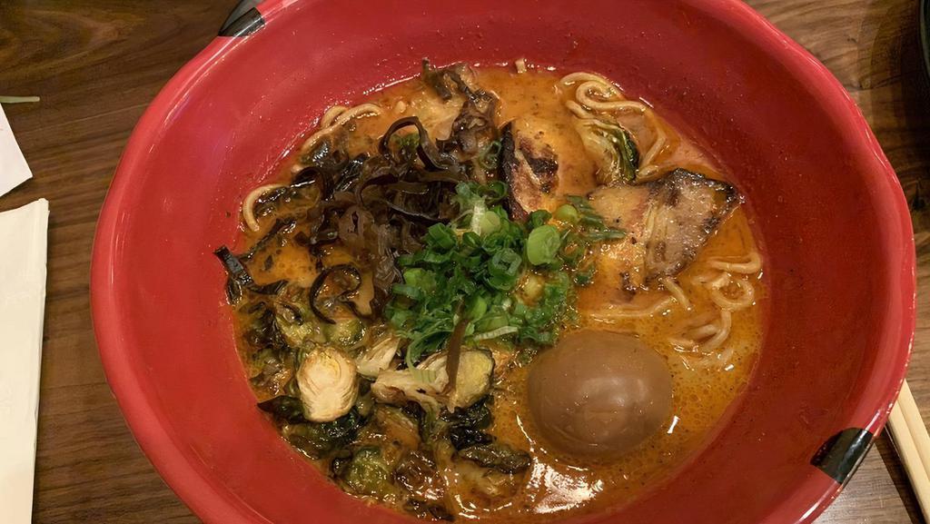 Shaki Shiaki Ramen · Pork and chicken broth: pork or chicken chashu, kikurage, spicy bean sprouts, green onion, half season egg, crispy brussel sprouts, black pepper, curry powder, basil. Served with thick noodles.