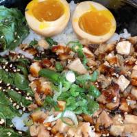 Pork Chashu Bowl · Slow-braised pork chashu, spinach, green onion, seasoned sesame seeds.