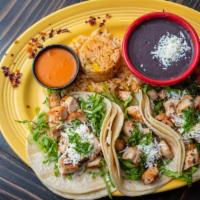 Tacos Machos · Three tacos on hard or soft corn or flour tortillas, garnished with lettuce, queso fresco an...