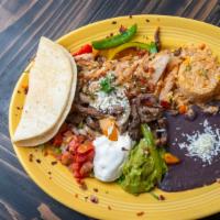 Fajitas Toro · Served with grilled onions, bell, jalapeño, or mixed peppers, a cheese quesadilla, tradition...