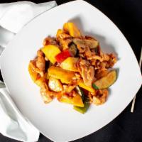 Mango Chicken · Sliced chicken stir fried with sliced mango, carrots, zucchini, green, and red peppers.