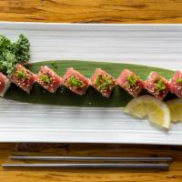 Red Dragon · Spicy tuna, tempura flakes,wrapped with tuna sashimi and chives.