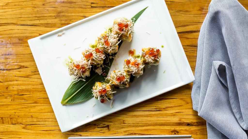 Tsukiji Maki · Seared white tuna wrapped over spicy salmon, thai basil, taro crisp, and salmon caviar.
