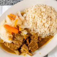 Curry Goat Entree · Served with plantain, steamed vegetables and your choice of rice and peas or white rice.