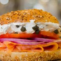 Classic Smoked Salmon & Capers · Smoked salmon, scallion cream cheese, tomato, onions, and capers on your favorite bagel. Ser...