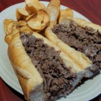 Philly Cheesesteak · BEEF or CHICKEN CHEESESTEAK on a toasted roll, served w/ American cheese, homemade chips.