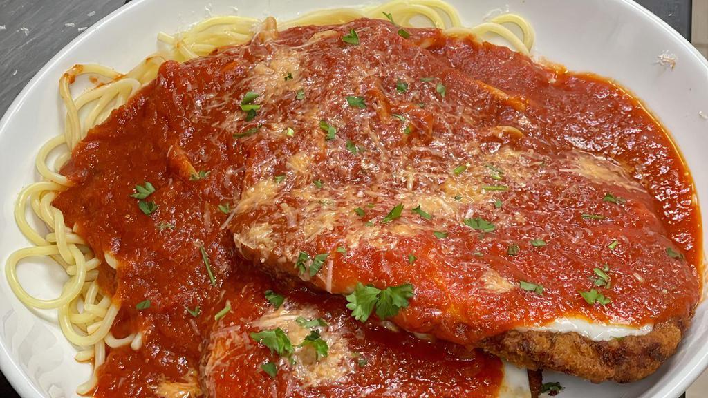 Chicken Parmigiana · Topped with Mozzarella and fresh tomato sauce. All entrées are served with pasta or baked potato, side of veggies, soup or salad, and bread.