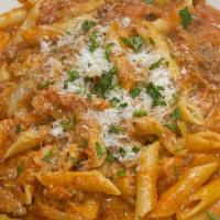 Pasta Bolognese · Onions, celery, carrots, and ground beef sautéed in a rosé sauce, tossed with your choice of...