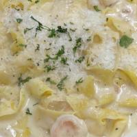 Seafood Alfredo · Shrimp, scallops and calamari sautéed and tossed in Alfredo sauce with your choice of pasta....