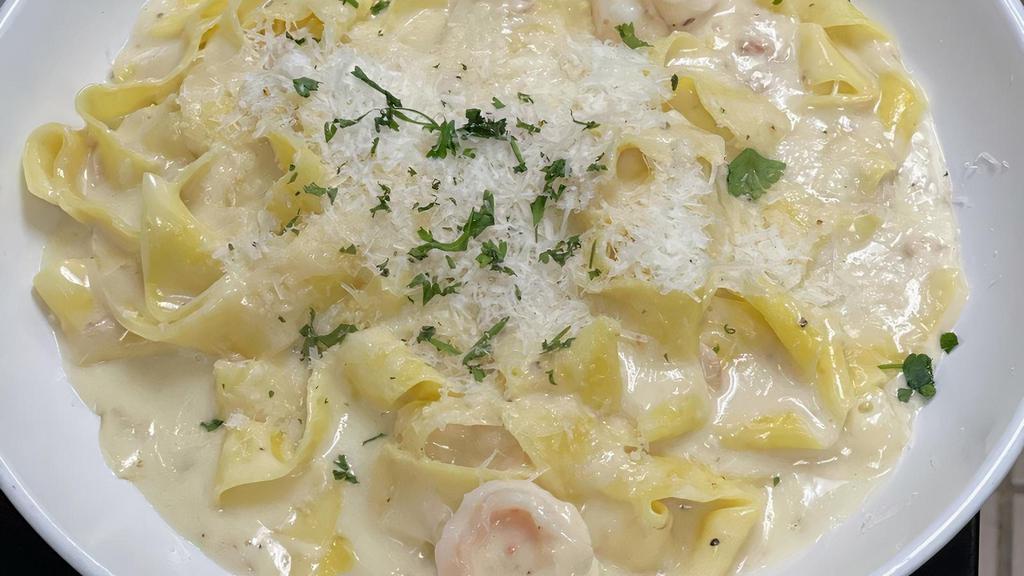 Seafood Alfredo · Shrimp, scallops and calamari sautéed and tossed in Alfredo sauce with your choice of pasta. Served with soup or salad and bread.