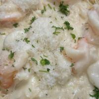 Shrimps & Scallops Au Gratin · Sautéed in alfredo sauce topped with Provolone cheese. Served with pasta, baked potato or a ...