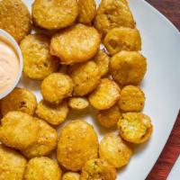 Fried Pickles · Crispy fried dill pickles, served with texas petal sauce.