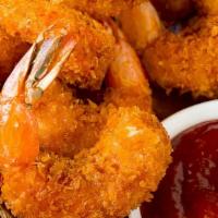 Golden Fried Shrimp · 6 crispy  shrimp made to order
Paired with Seasoned Parmesan fries