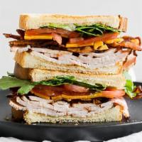 Turkey & Bacon · All-Natural Turkey, Slab Bacon, Swiss, Chipotle Mayo, and Lettuce. Served on grain bread.