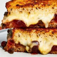 Grilled Cheese · Gooey American Cheese and Challah Bread.