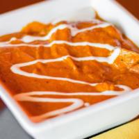Chicken Tikka Masala · Boneless tandoori-roasted cubes of yogurt marinated chicken, cooked in a creamy curried sauce.