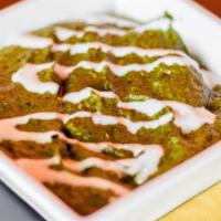 Saag Paneer · Homemade paneer cheese in a puréed sauce of spinach, tomato, green chili and touch of fenugr...