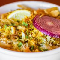 Sufyani Chicken Dum Biryani · Basmati rice cooked in chili stock, with spicy chicken and fennel.