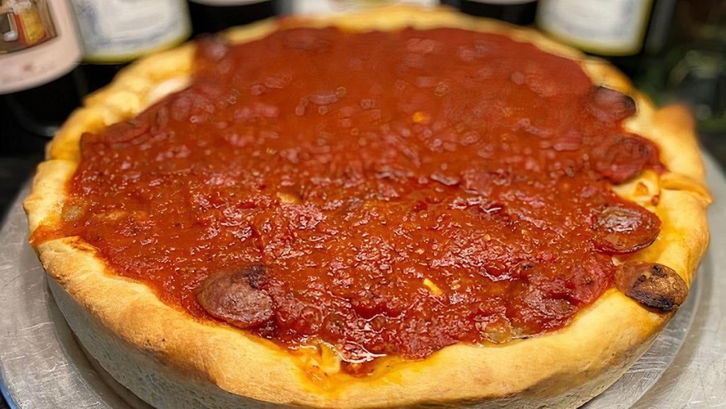 Chi-Pie · Deep dish chicago style! layers of flaky crust, melted Wisconsin brick cheese and house pizza sauce with pepperoni, Italian sausage and onion - please allow 45 minutes for baking! -