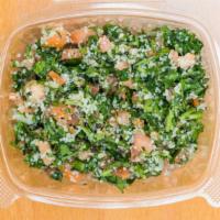Tabouli · A salad of minced parsley, lettuce, cucumbers, diced tomatoes, bulgur, lemon juice, and oliv...