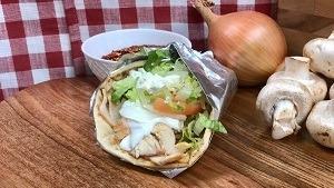 Chicken Souvlaki Platter · Chicken souvlaki sandwich with fries.