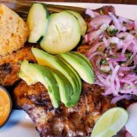 Cazuela De Pollo · Chicken breast sauteed with tomatoes, onions and green peppers, rice, beans and salad.