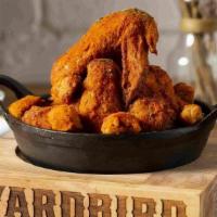 Yardbird Chicken Wings · twice-fried, tossed with Louisiana hot sauce, housemade. buttermilk ranch, house fries