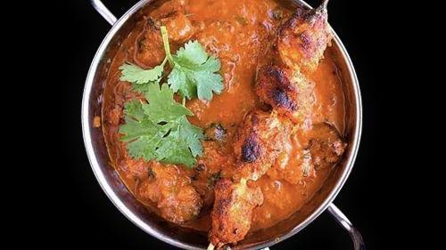 Chicken Curry · Gluten free. Boneless chicken simmered in tomato and onion gravy.