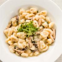 Gnocchi Agli Funghi · House made potato dumplings tossed with wild mushrooms, garlic, olive oil and a touch of but...