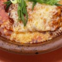 Lasagna Di Carne  · Sheets of lasagna layered with braised sirloin, Ricotta, Mozzarella, Parmiggiano and tomato ...